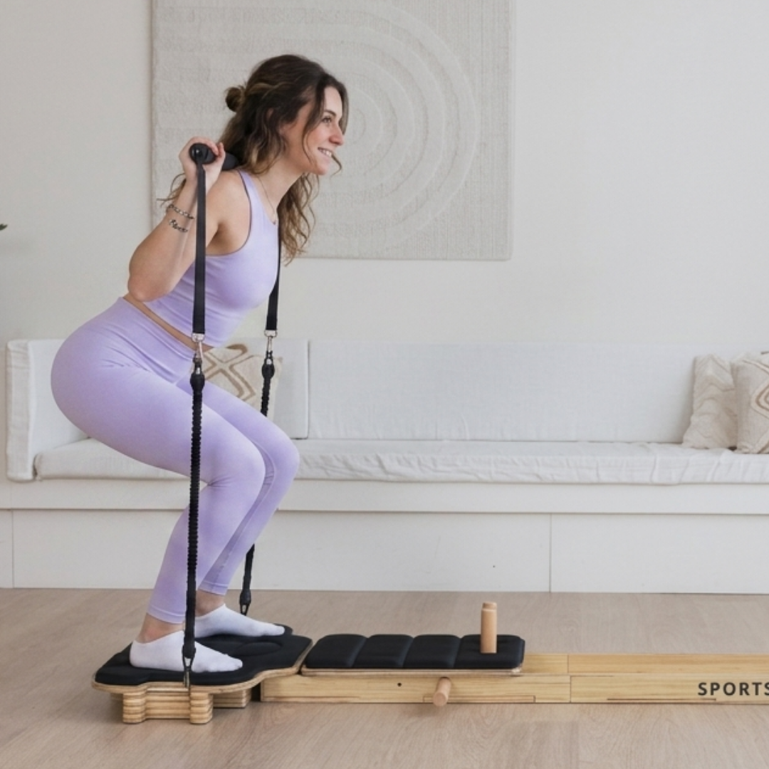 En de reformer squat voor benen en billen.